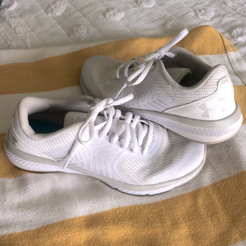 Under Armor two tone cream/white women’s training sneakers.